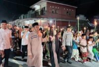 Bupati Tojo Una-Una, Ilham Lawidu bersama Wakil Bupati Hj Surya Lapasiri melepas dan mengikuti Pawai Obor dalam rangka menyambut datangnya Bulan Suci Ramdhan 1447 Hijriah 2026 M, Minggu malam (15/2).