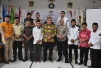 Tommy Boy Luasusun, S.H., M.A.P., saat mewakili Bupati dalam Rapat Pleno Rekapitulasi Pemutakhiran Data Pemilih Berkelanjutan (PDPB) Triwulan I Tahun 2026, Kamis (2/4/2026).